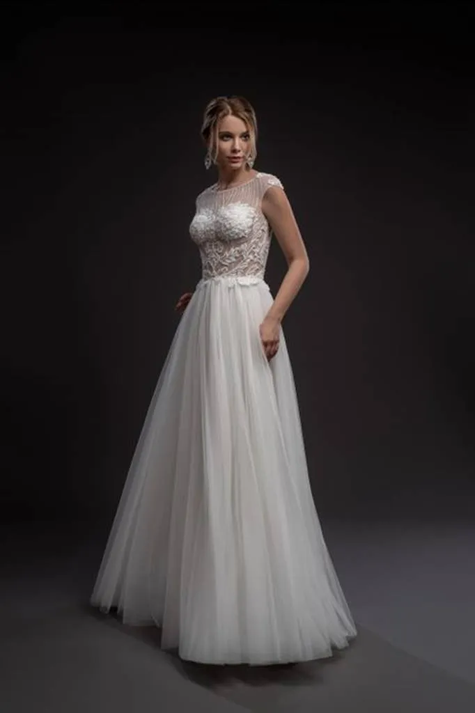 ---Trends 2022 wedding dress made of satin, tulle and lace decorations with illusions on the bodice--