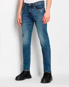 Jeans J13 slim lavaggio medio stone washed con baffature e micro abrasioni